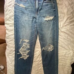 baggy jeans with a rip at ankle and knee